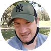 Client wearing NY cap during outdoor video call